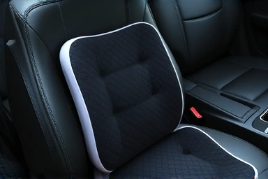 Ergonomic car lumbar support cushion on a car seat.