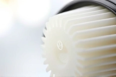 Close-up of clean fuel filter, automotive maintenance, engine part.