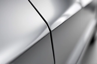 Close-up of new car panel gap, perfect alignment.