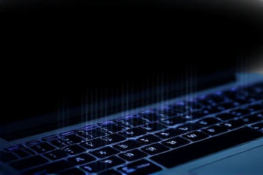 Laptop keyboard cover emitting subtle heat waves.