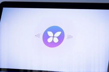 MacBook AirDrop icon with digital waves