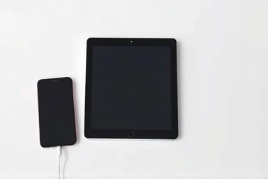 Tablet and smartphone connected, symbolizing communication upgrade.