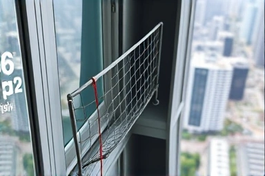 Baby safety net protecting a high-rise apartment balcony.