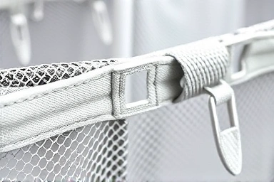 Close-up of strong baby safety net material and lock.