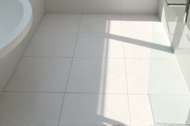 Subtle non-slip stickers on a clean bathroom floor.