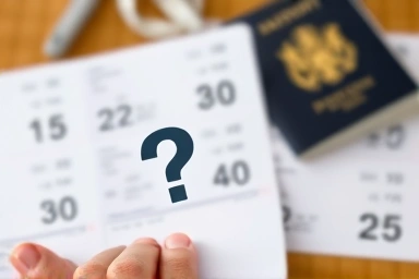 Hand holding travel itinerary with question mark, symbolizing booking uncertainty.