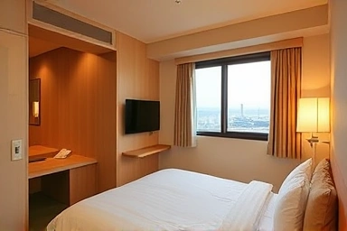 Modern, comfortable hotel room interior with city view.