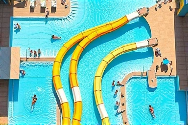 Aerial view of a lively water park with slides and pools.
