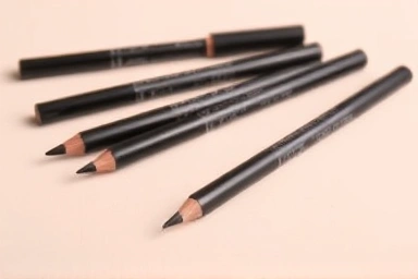 Assortment of high-quality pencil eyeliners, minimalist design.