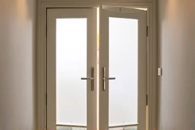 Stylish swing door in narrow entryway, emphasizing smooth opening.