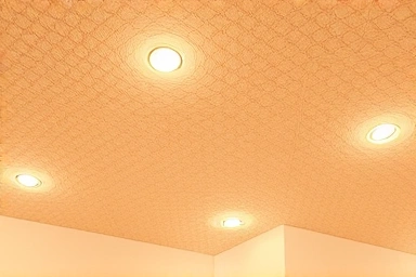 Recessed ceiling downlights creating warm ambiance