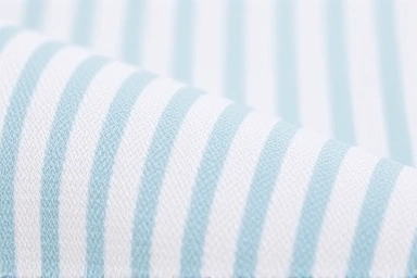 Close-up texture of breathable seersucker fabric.