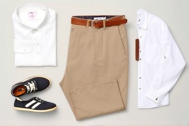 Flat lay of Giordano pencil-fit slacks with styling accessories.