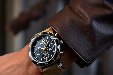 Close-up of a stylish men's automatic watch on a wrist.