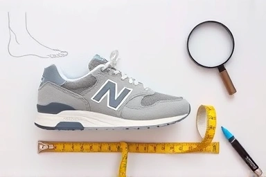 New Balance 992 Grey shoe with sizing tools