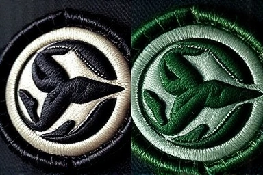 Authentic vs. counterfeit Stone Island badge stitching comparison