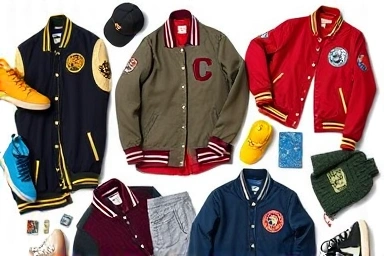 Flat lay of diverse varsity jackets and styling accessories.
