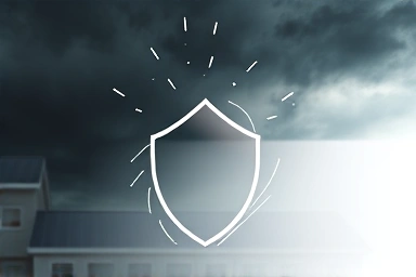 Protective shield deflecting earthquake damage from a house.