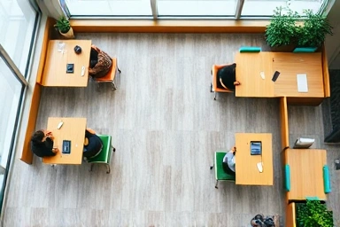 Organized study cafe layout with distinct work and group zones.