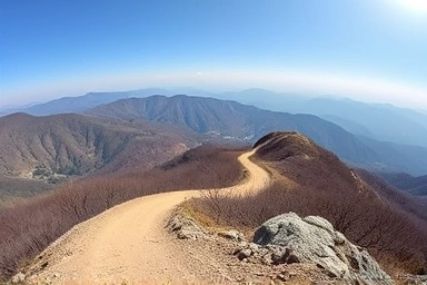 Scenic mountain landscape with winding dirt road in Gyeongsang Province