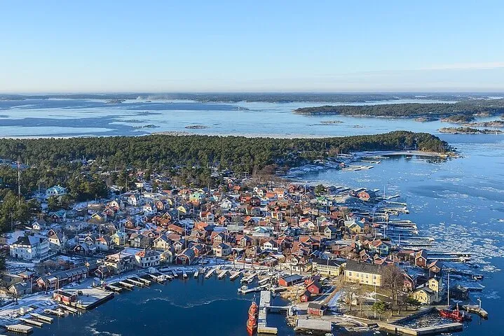 Aerial view colorful winter coastal village.