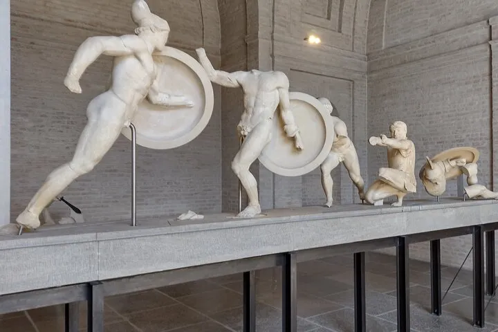 Ancient Greek marble warrior sculptures with shields.