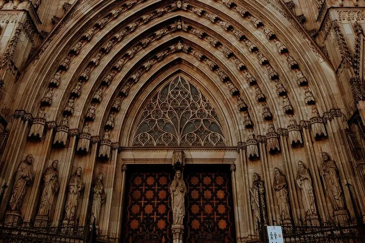 Ornate Gothic cathedral entrance with statues.