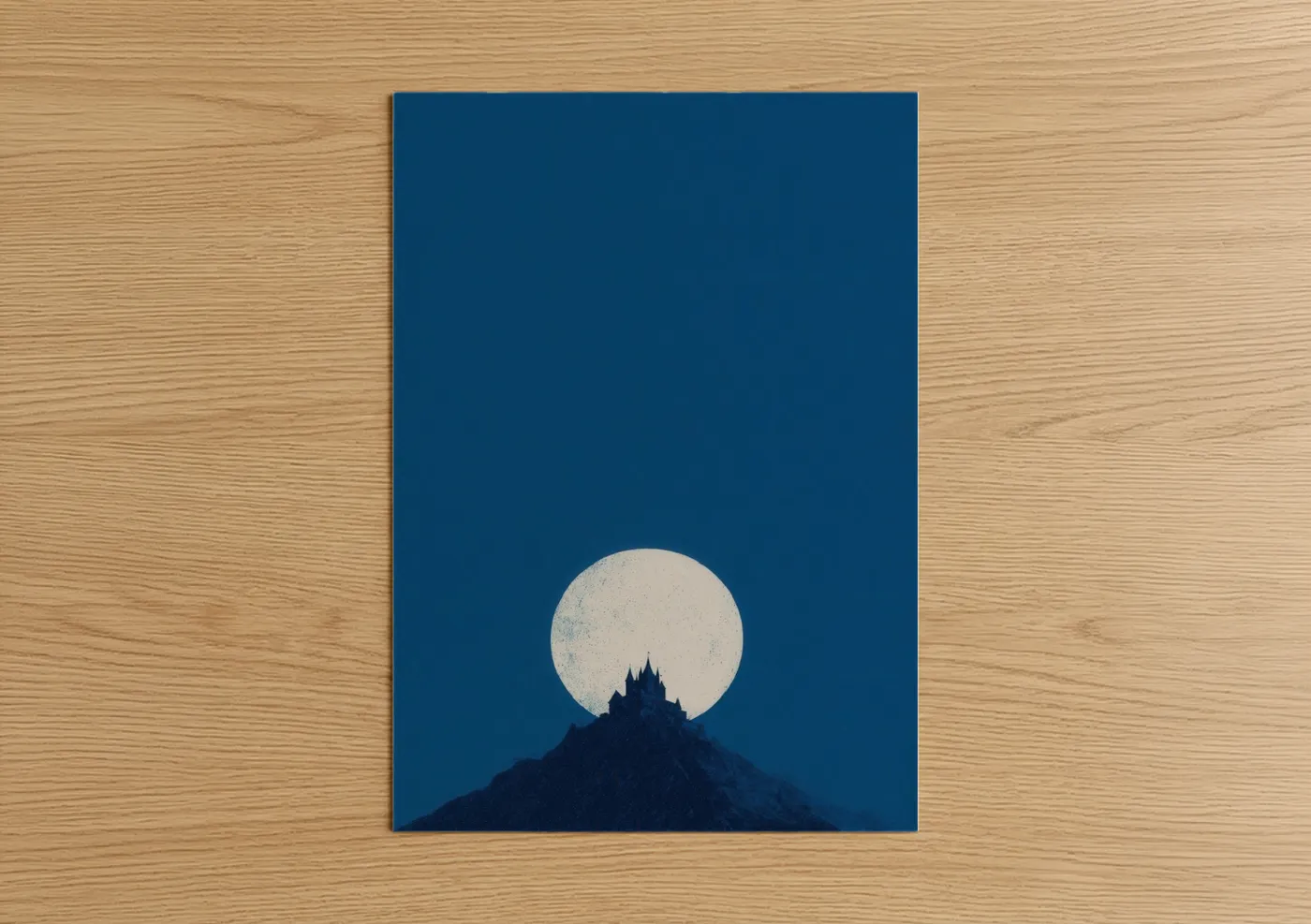 Art print on warm oak wood — dark blue and cream palette — Moonlit Castle poster