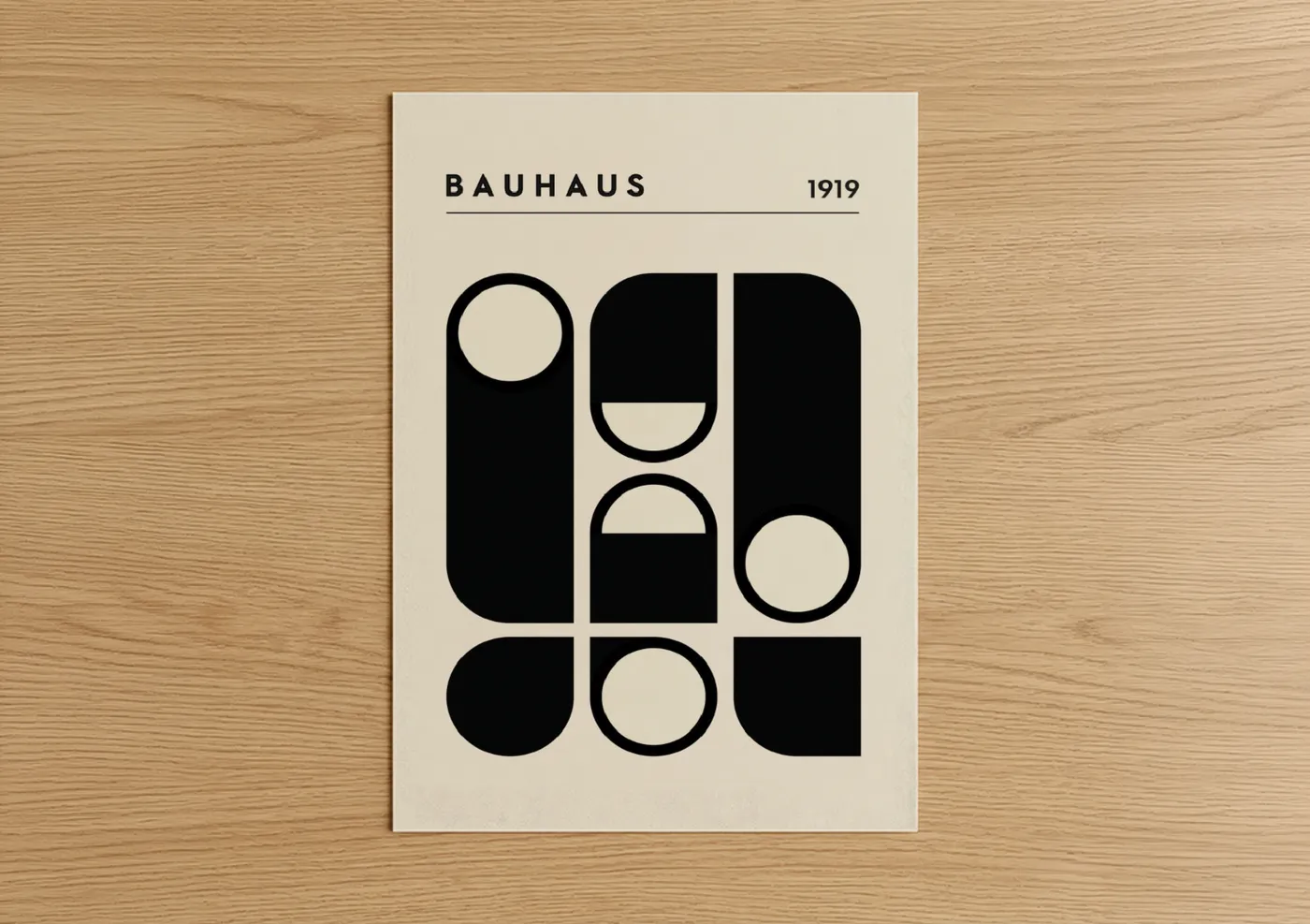 Abstract geometric art print on warm oak wood — black and cream palette — Bauhaus Circles poster