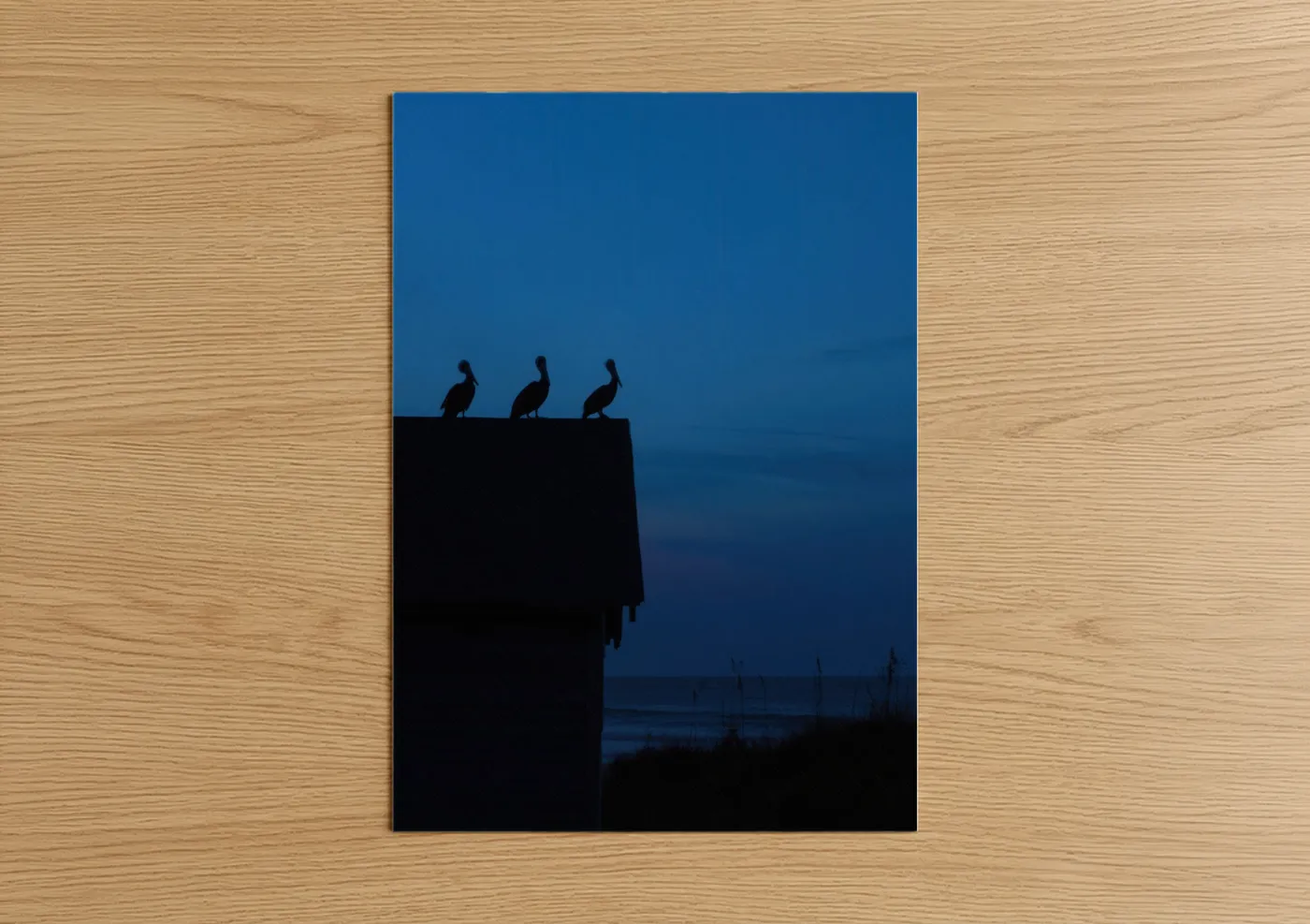 Art print on warm oak wood — dark blue and blue palette — Cliff Herons Dusk poster