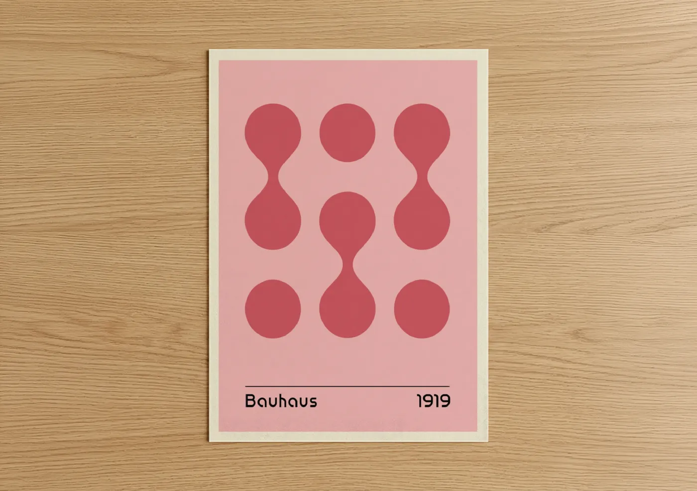 Abstract geometric art print on warm oak wood — pink and rose gold palette — Bauhaus Circles poster