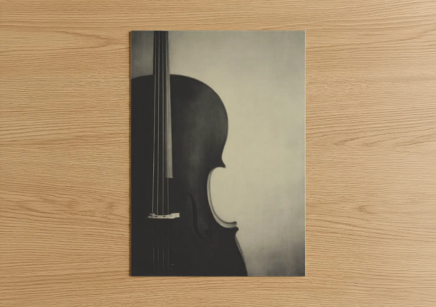 Art print on warm oak wood — black and white palette — Silhouette Cello poster