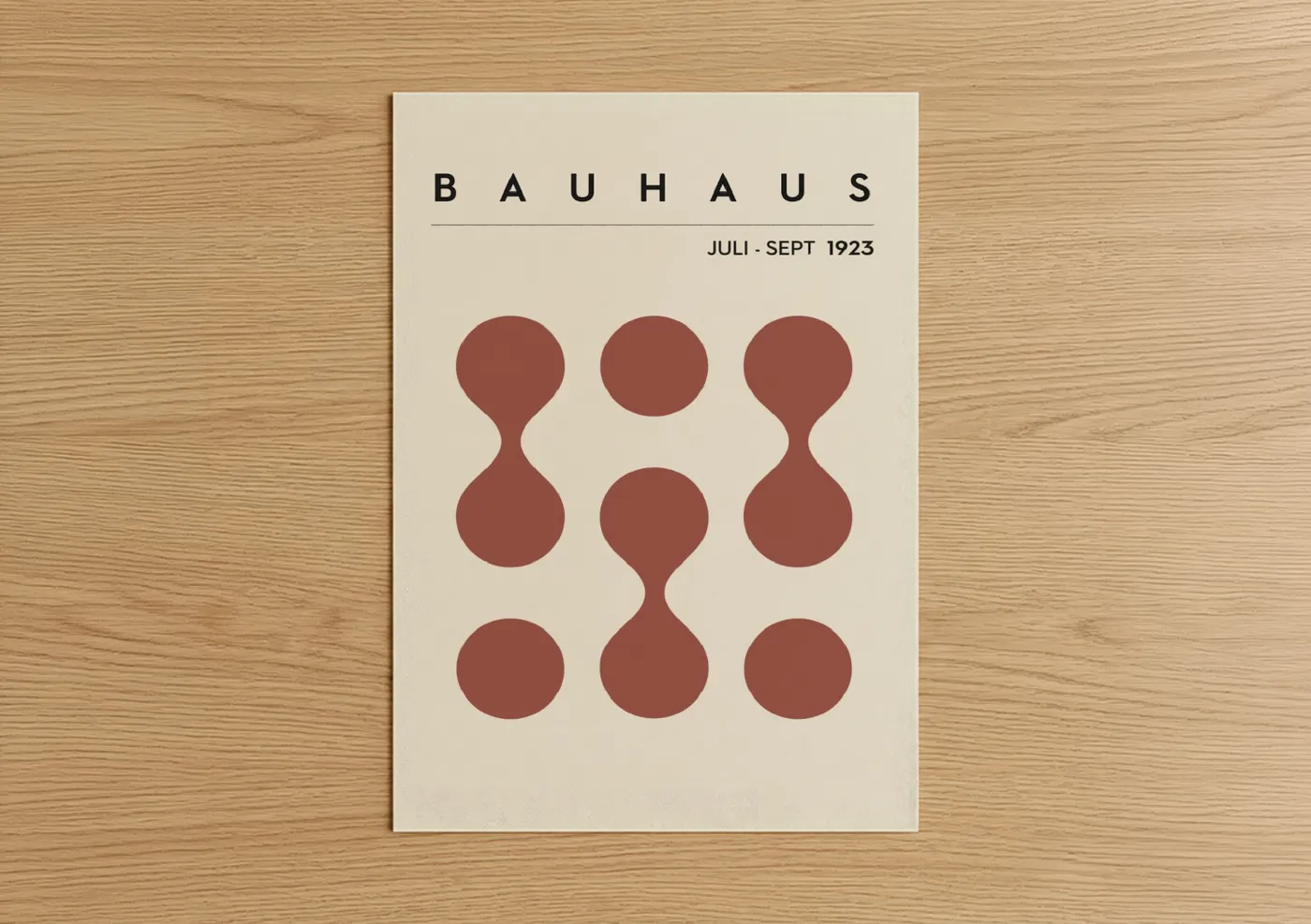 Abstract geometric art print on warm oak wood — maroon and cream palette — Bauhaus Circles poster
