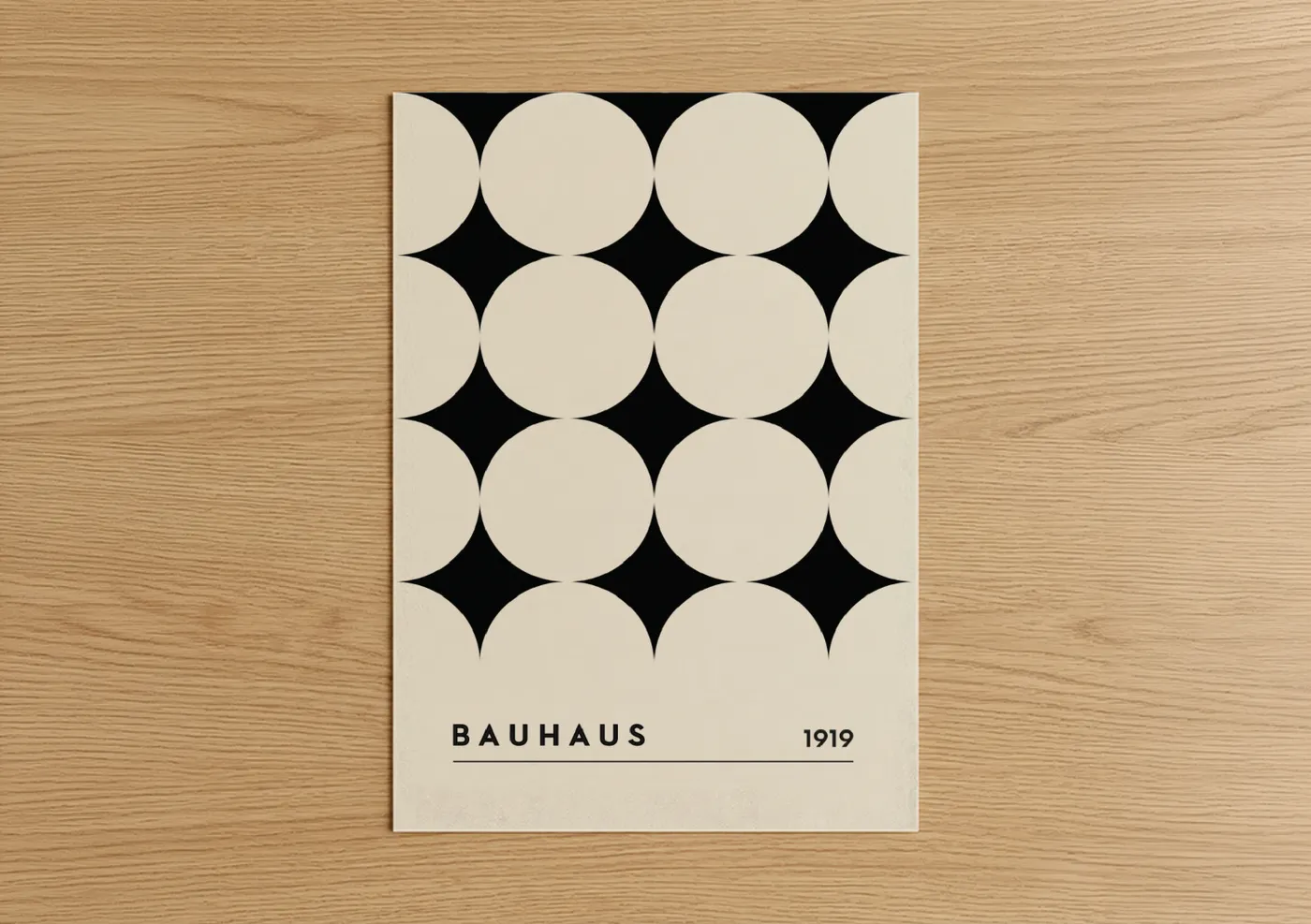 Abstract geometric art print on warm oak wood — black and white and cream palette — Bauhaus Circles poster