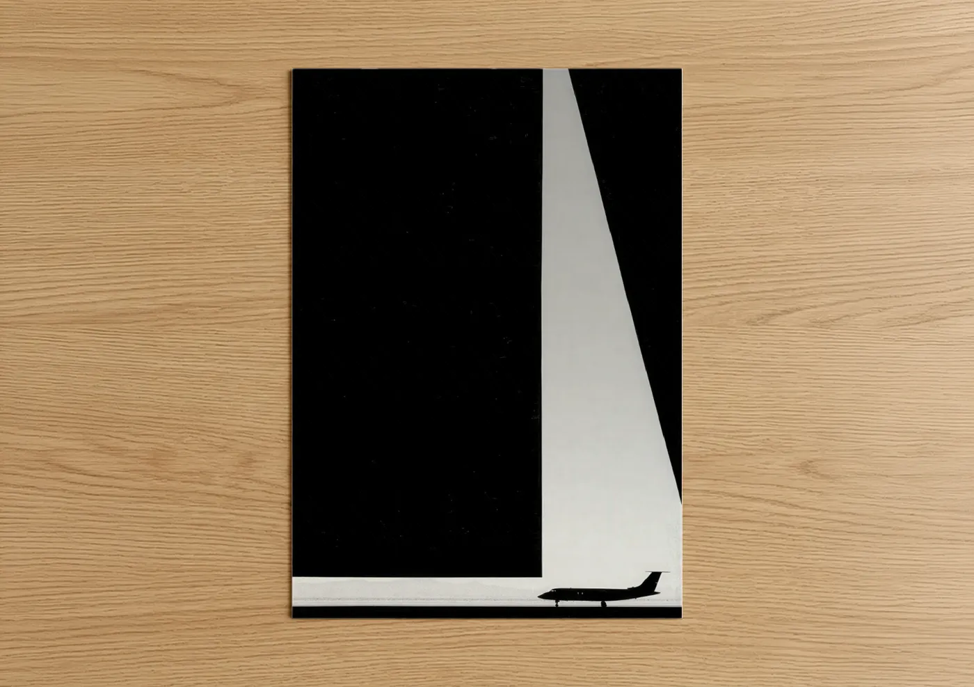 Private jet art print on warm oak wood — black and white palette — Sleek Jet Silhouette poster