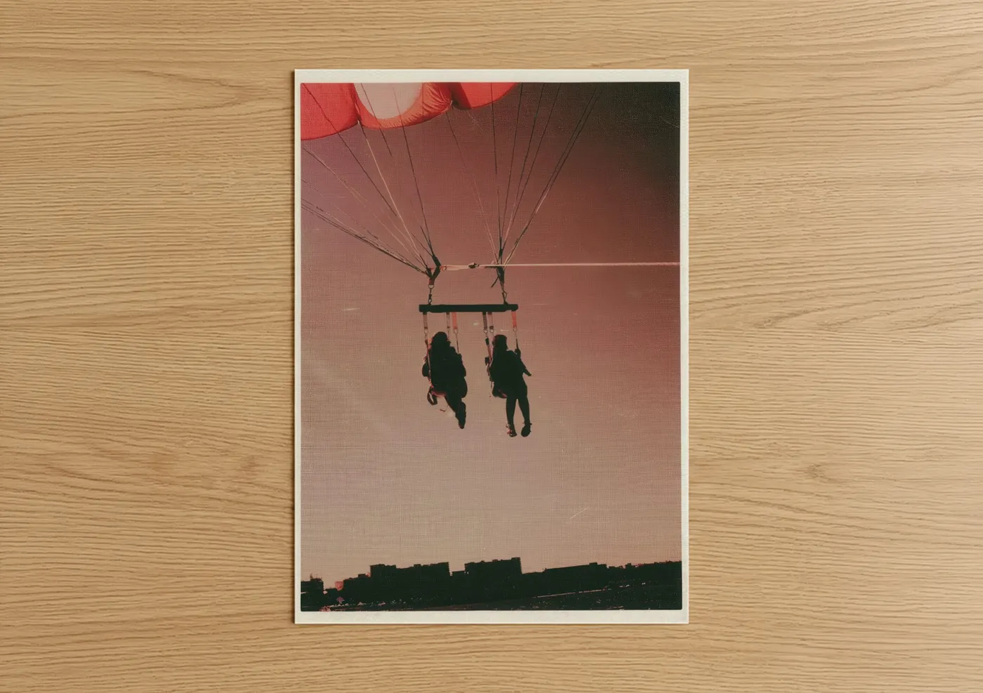 Parasailing art print on warm oak wood — red and gold palette — Sunset Parasail poster