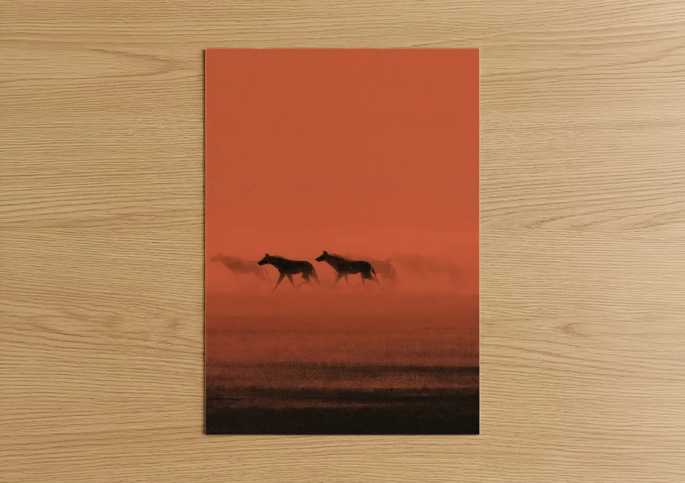 Art print on warm oak wood — orange and black palette — Desert Hyenas poster