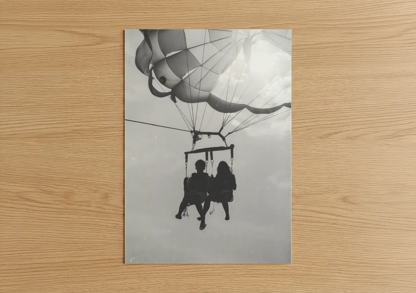 Parasailing art print on warm oak wood — black and white palette — Skybound Couple poster