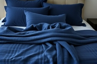 Close-up of tone-on-tone bedding with layered shades and textures