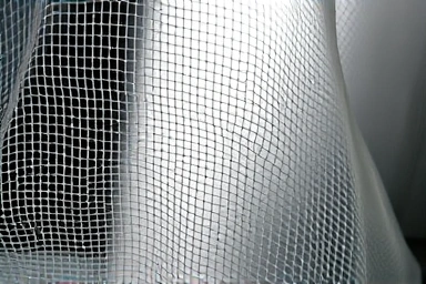 Close-up of fine mosquito net mesh, showing insect protection and airflow.