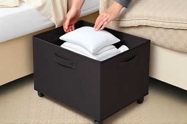 Convenient access to under-bed storage boxes with wheels.