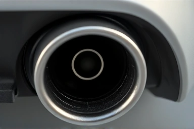 Car exhaust pipe emitting visible fumes.