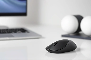 MacBook Pro with Logitech MX Anywhere 3S mouse on a modern desk.