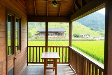 Peaceful Namhae guesthouse balcony overlooking rice paddies