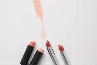 Assortment of makeup contour sticks in neutral and cool tones.