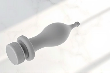 Modern cellulite roller tool on marble surface.