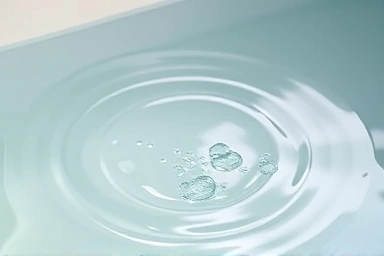 Close-up of rippling water in a bathtub, symbolizing calm.
