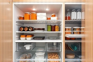 Smart storage solutions inside a custom pantry for kimchi refrigerator.