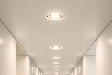Evenly spaced recessed downlights in hallway ceiling