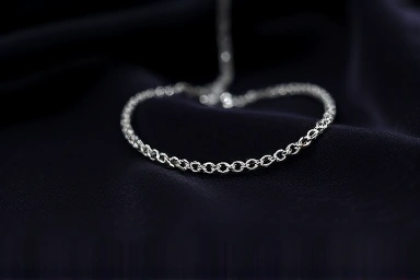Elegant silver choker necklace on dark velvet.